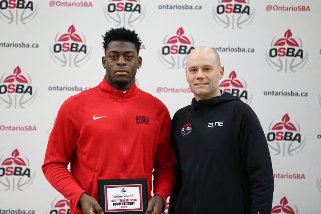 OBA Executive Director Jason Jansson (pictured on the right) presenting the 2018 Ontario Scholastic Basketball Association First Team All-Star Award to Luguentz Dort (pictured on the left).