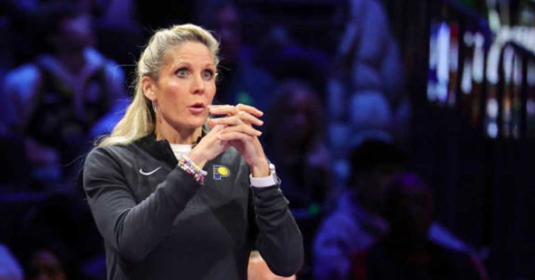 Jenny Boucek in Indiana Pacers gear on the sideline during a game