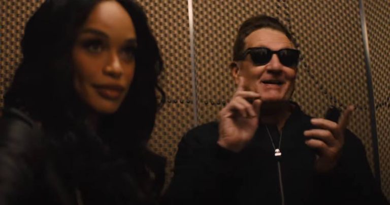 Scene from Hulu’s Clipped showing a woman beside a man wearing sunglasses.