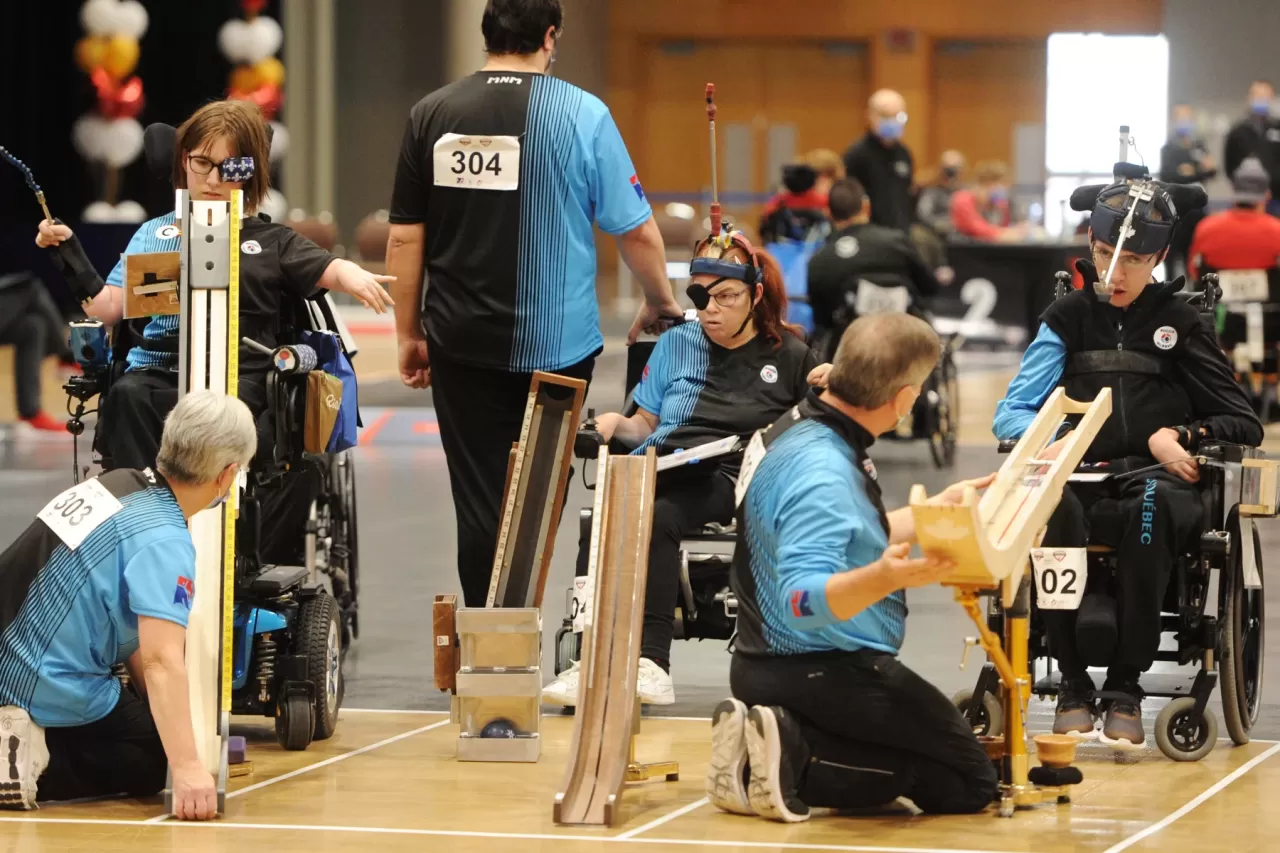 A BC3 boccia team illustrates the ramp operator role in AQSPC’s careers presentation.