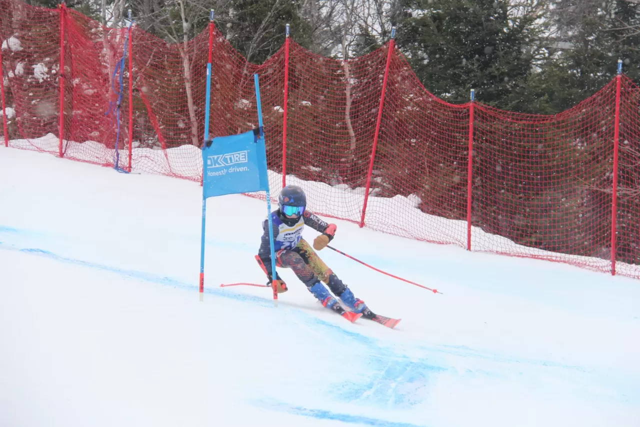 A Ski NB athlete competes on a ski race course.