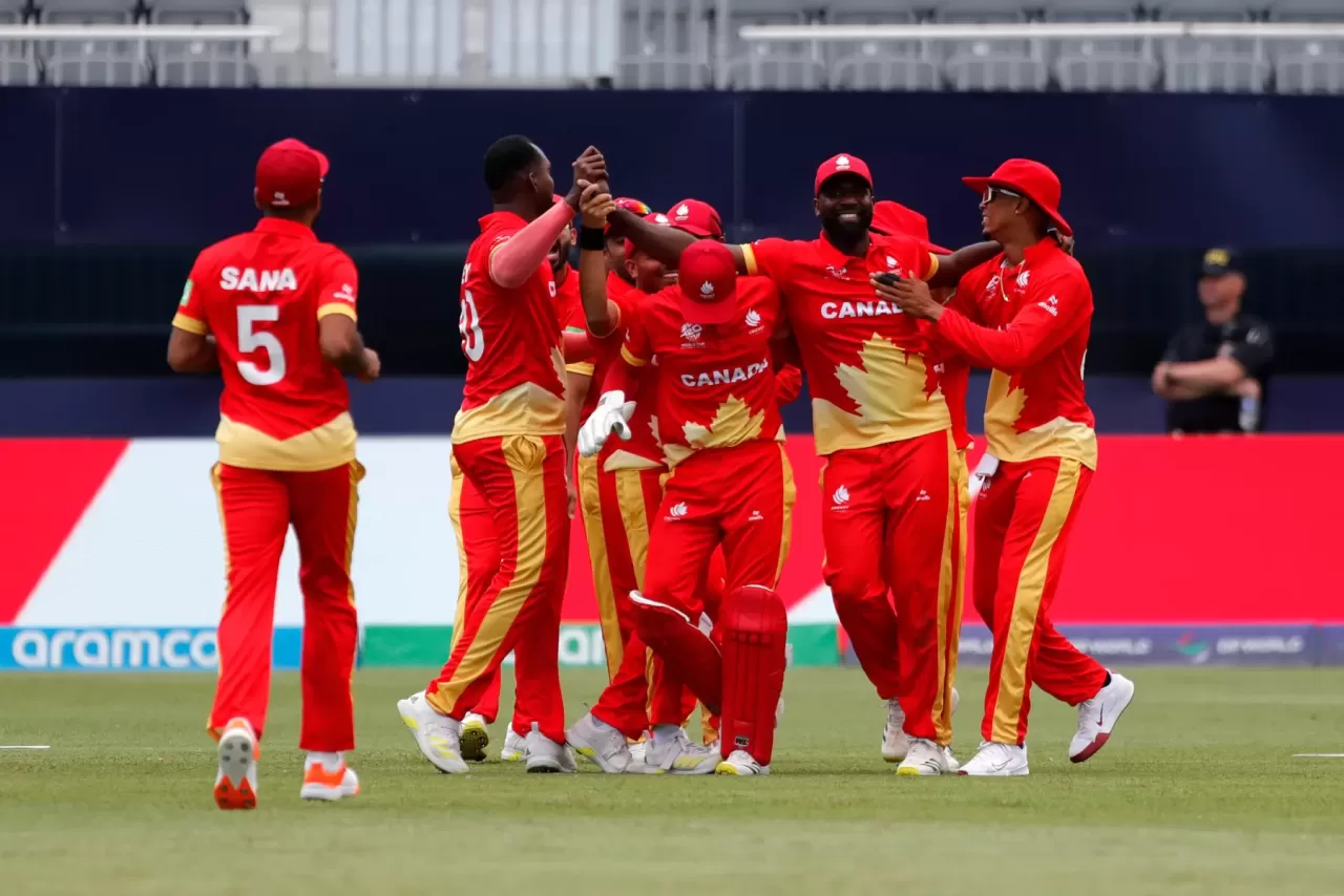 Canada players celebrate during an international cricket match.