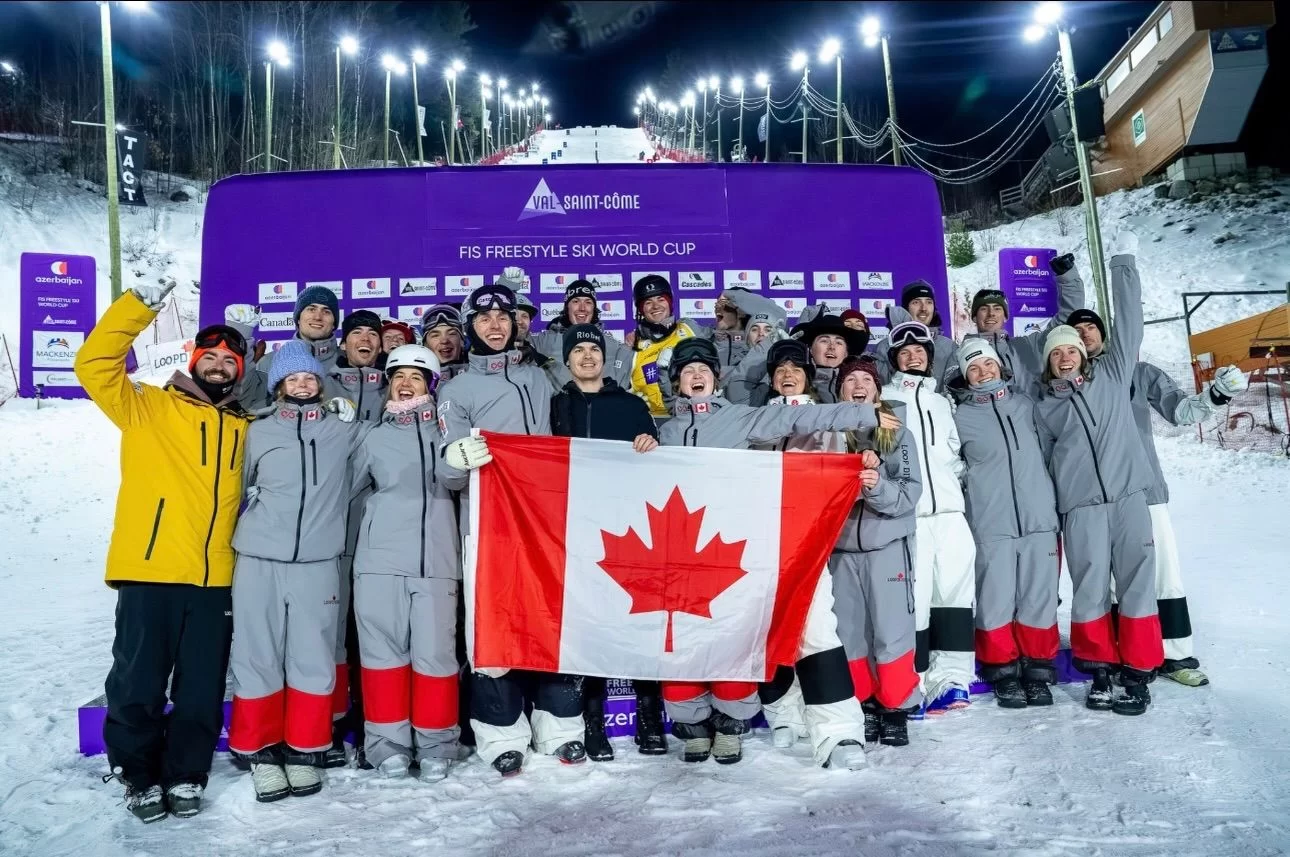 Canadian freestyle skiing team pictured with the national flag.
