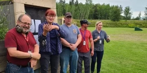 Shooting sports participants at an outdoor event