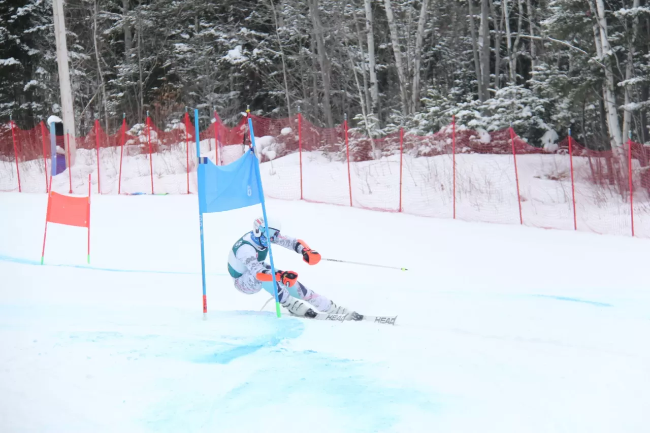 A Ski NB athlete races through gates.