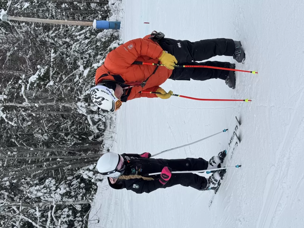 A Ski NB coach works with athletes.