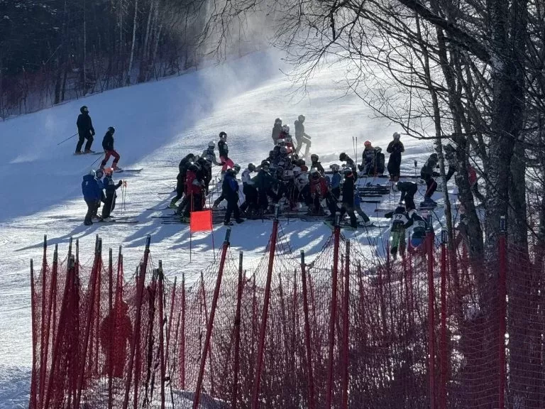 Ski NB athletes gather near the race start.