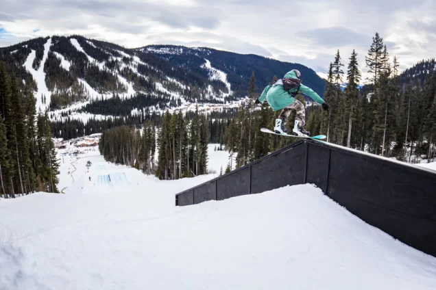 Snowboarder in action at a terrain park