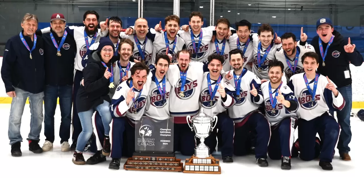 Broomball championship team pictured with trophies on Broomball Canada's website.
