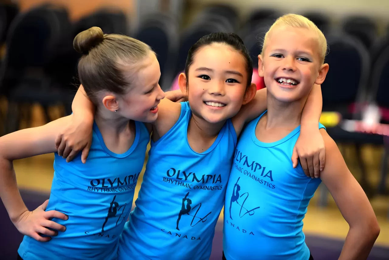 Rhythmic gymnasts together at an event