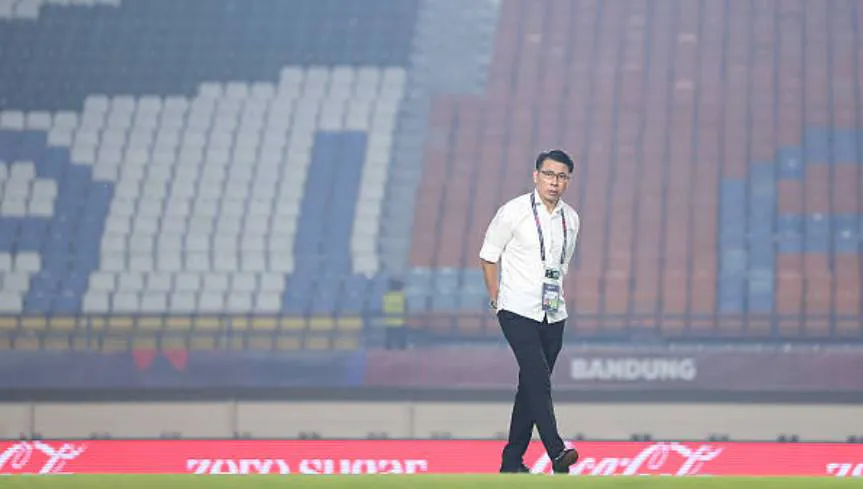 Sports operations professional standing on a stadium field
