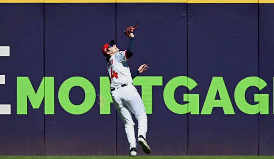 Who decides whether a baseball play is a hit or an error?